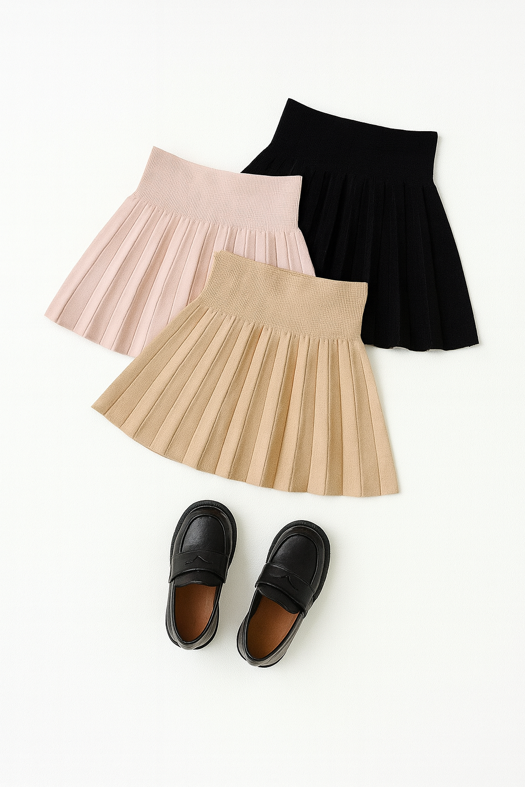 Gonnellina plissettata neonata DIVINA disponibile in beige e nero