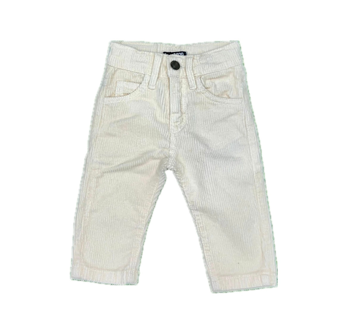 Pantalone di velluto disponibile in crema  o nero dalla 9 alla 36 mesi